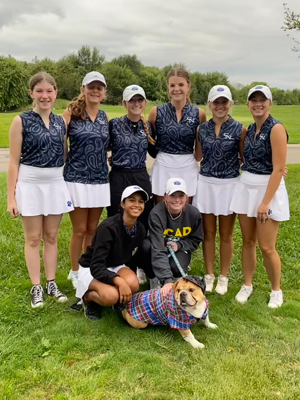 Dogs topple Olympians in girls golf cover photo
